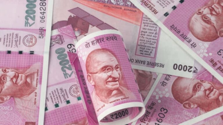 indian-rupee-declines-to-record-low-after-government-raises-tax-on-capital-gains